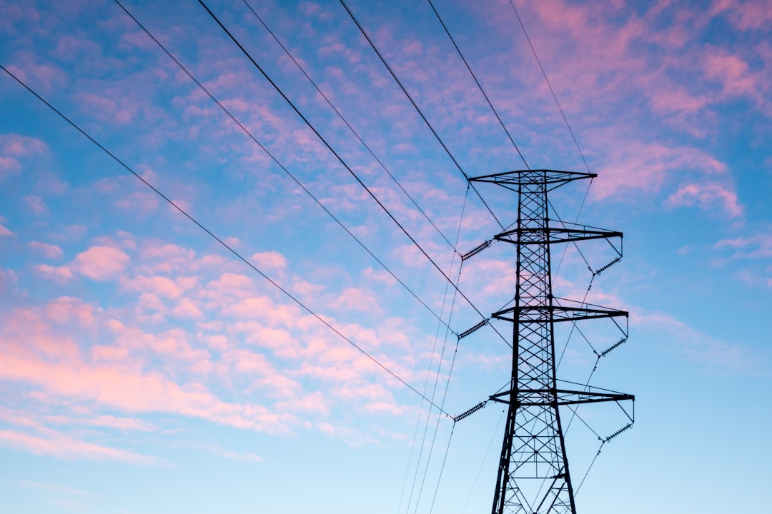 High-voltage transmission lines. The grid ASEAN planned region-wide is starting as bilateral links around Singapore.